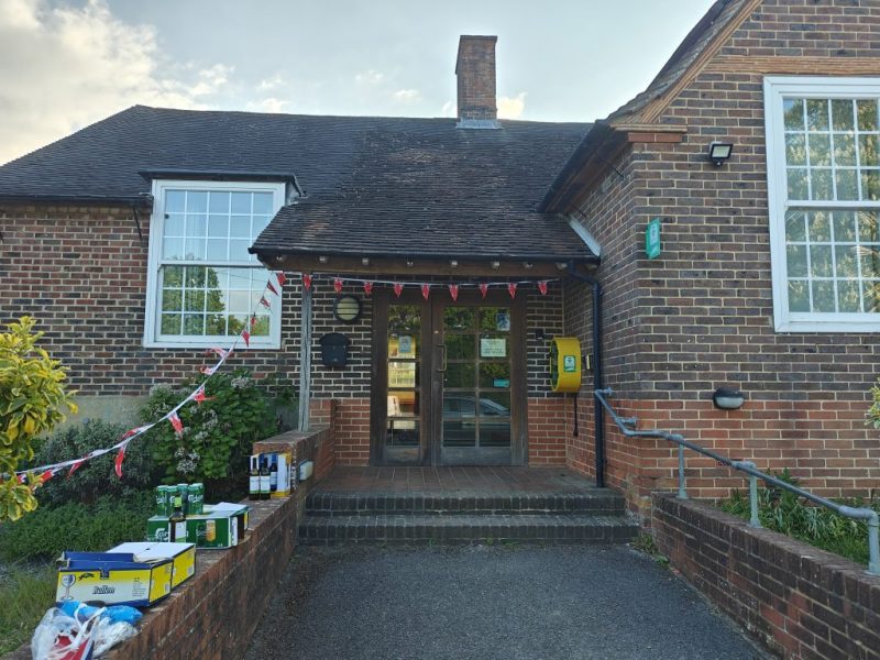 The front of the Hall decked with Bunting and Beer